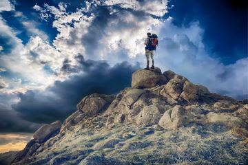 Man on top of a mountain