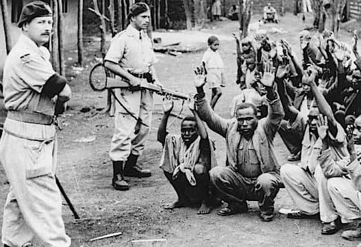 British colonial officers stand guard.